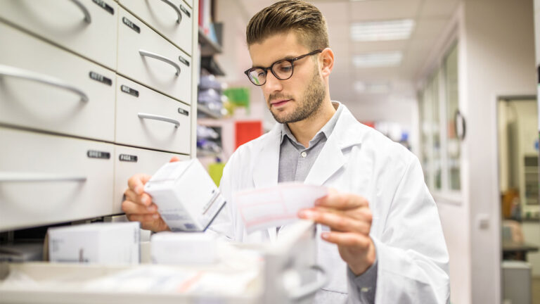 Pharmacist checking prescription